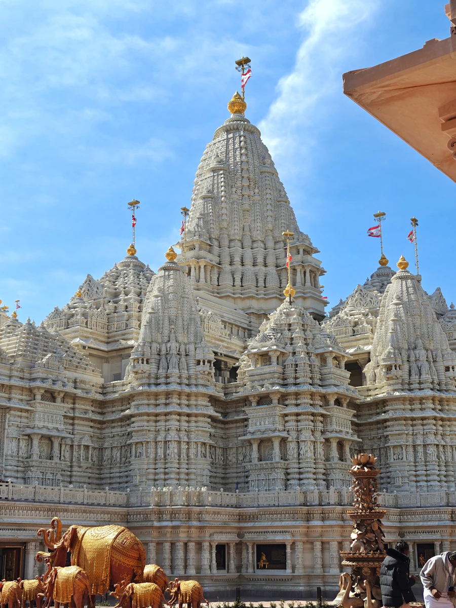 Intricately carved white temple towers at BAPS Akshardham USA