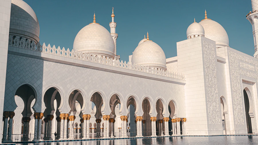 White domes and arched colonnades at the Sheikh Zayed Grand Mosque