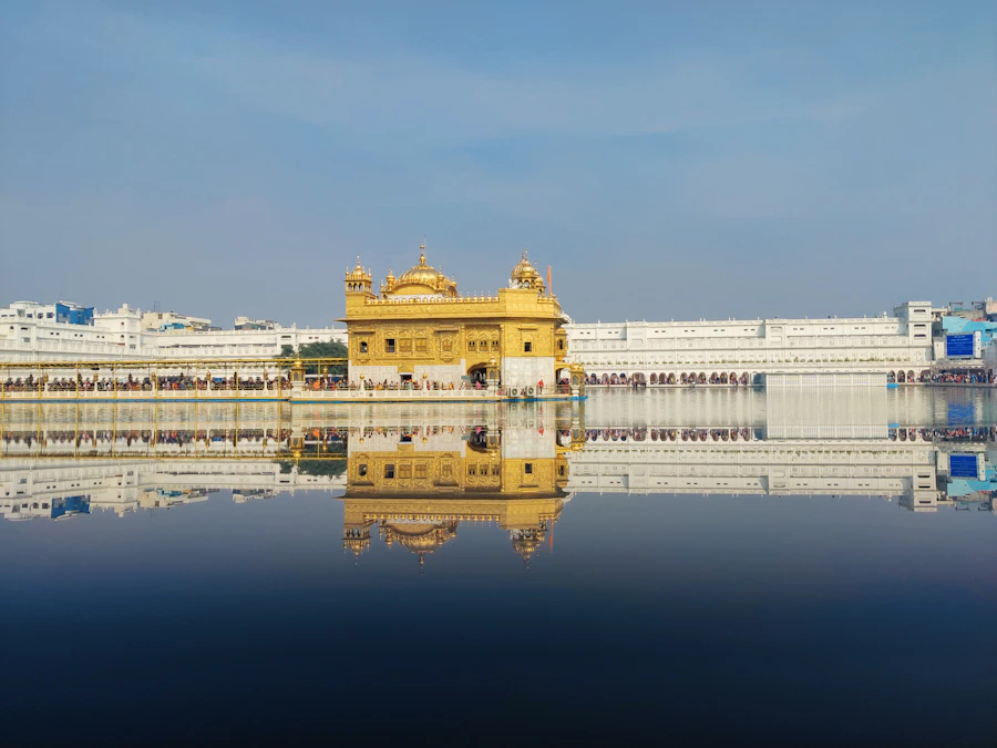The Golden Temple in Amritsar reflected in calm water